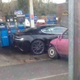 Illustration for article titled $275,000 Aston Martin DBS Totaled By Bright Pink Hatchback